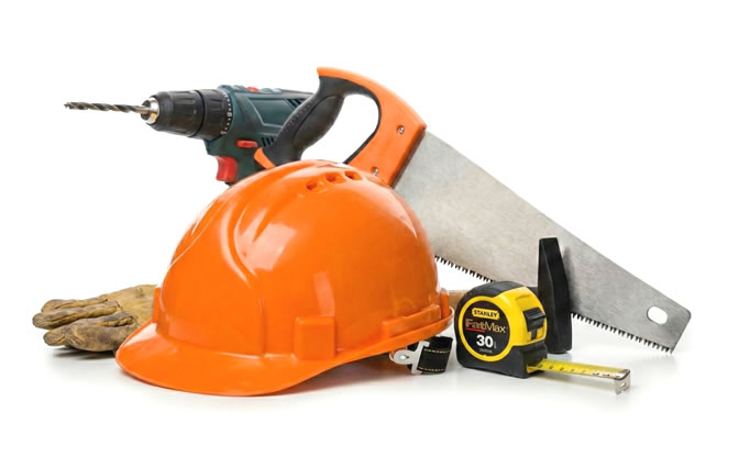 Bouwgereedschap met helm en boor